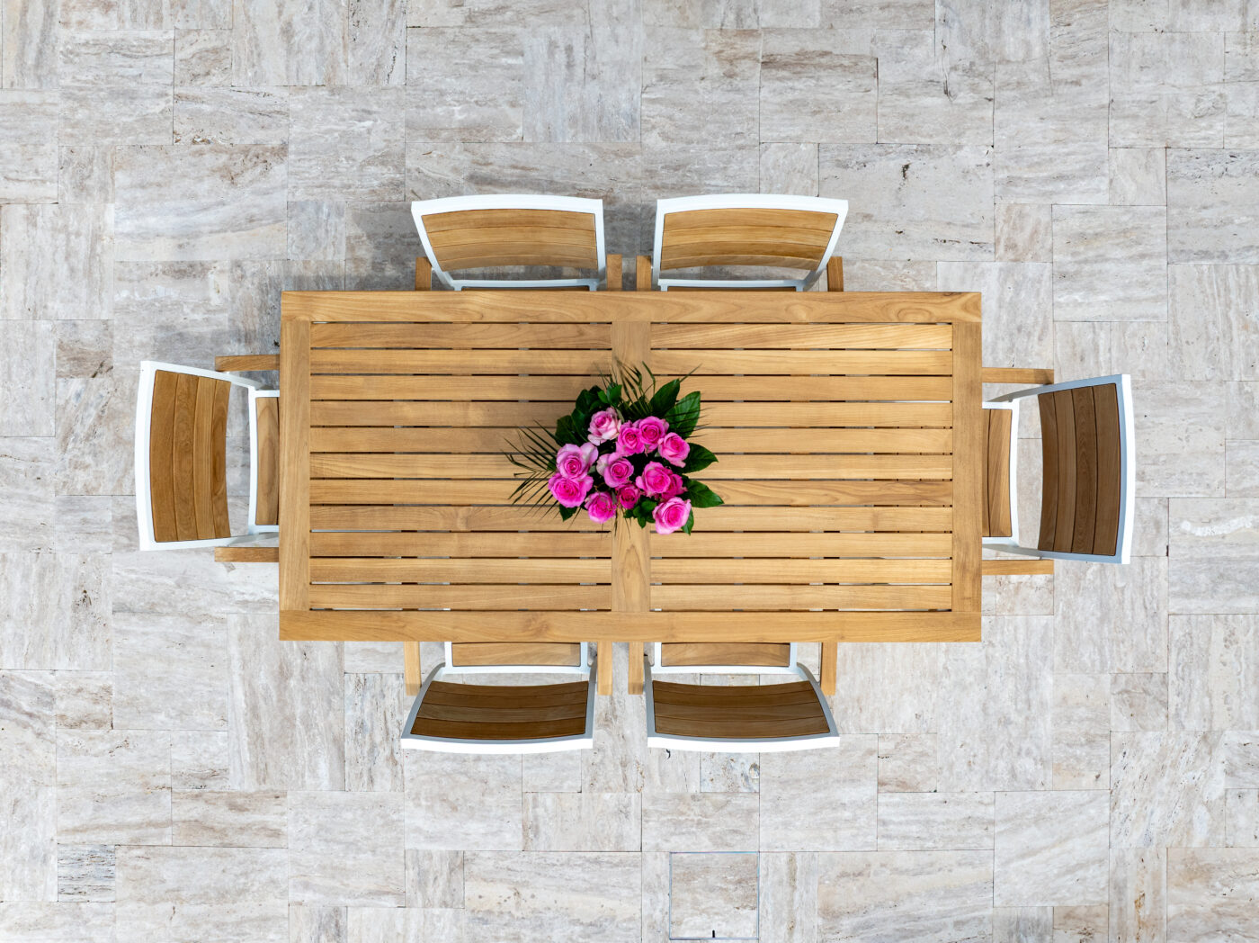 Aerial view of a outdoor chairs and a table with a floral center piece